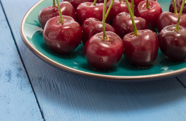 cherries on a blue board
