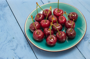 cherries on a blue board