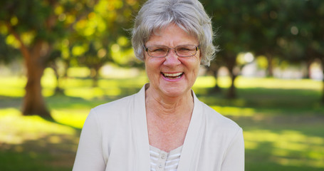 Senior woman blowing kisses at camera