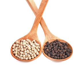 Black Pepper ,White Pepper Corns in wooden spoon isolated white