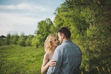 Newly-married couple in the wood about a tree 3194.