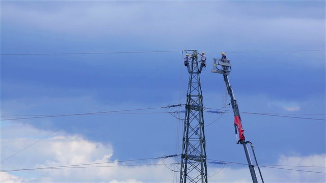 Electric workers Fixing Power Lines