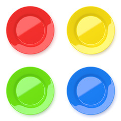 empty color ceramic round plates on white