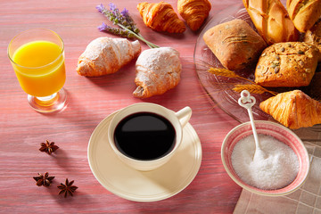 Obraz na płótnie Canvas Coffe breakfast with orange juice croissant bread