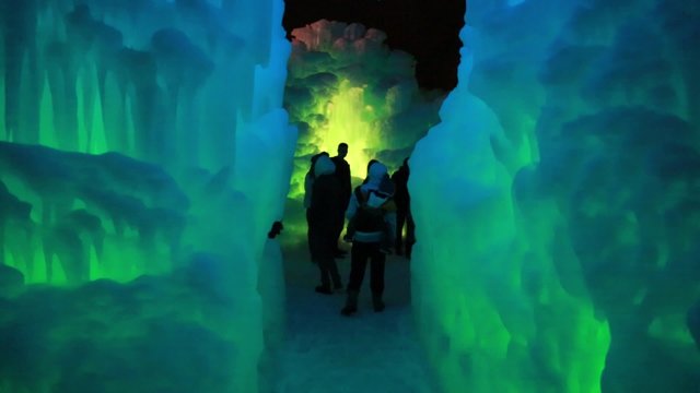 tourists at an ice castle