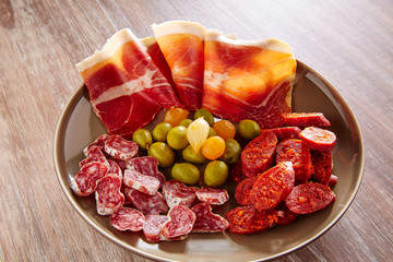 Tapas of Spain with ham olives sausage chorizo