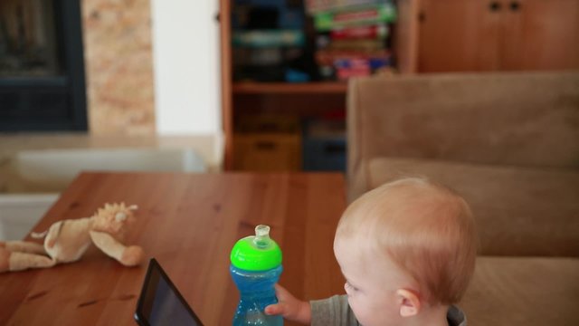 boy watching a movie on a tablet