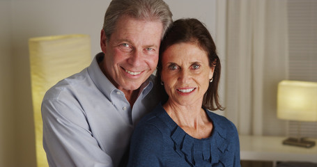 Portrait of happy senior couple smiling