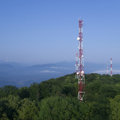 Obraz premium Metal structures on the top of high mountain in fog