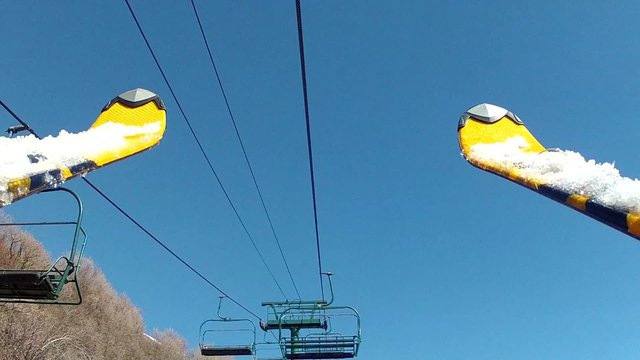 skis on chair lift