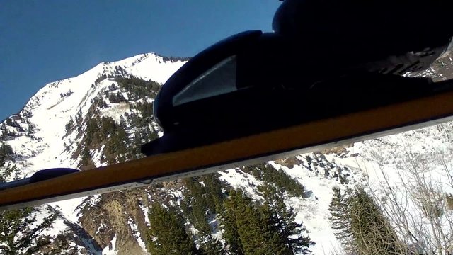 ski riding up a ski lift