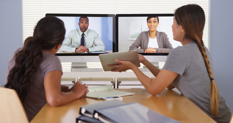 Hardworking team of diverse business colleagues having a video conference