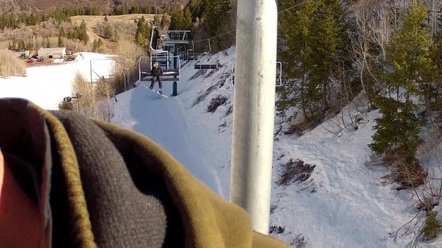 riding up the ski chair lift