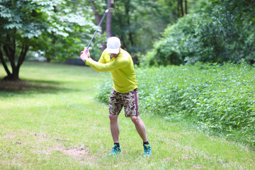 Golfer in Camouflage Shorts