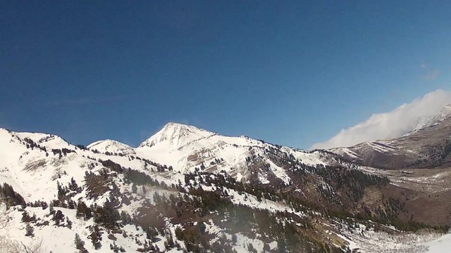 snow blowing across ground