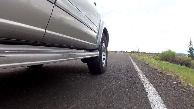 an suv driving on a road