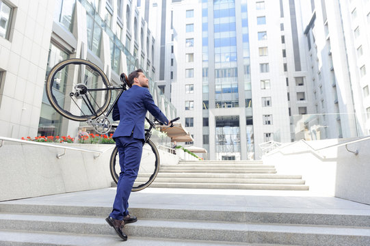 Nice man holding bicycle 