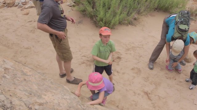 family playing in desert