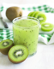 Glass of kiwi juice and fresh fruits