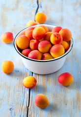 apricots on wooden surface