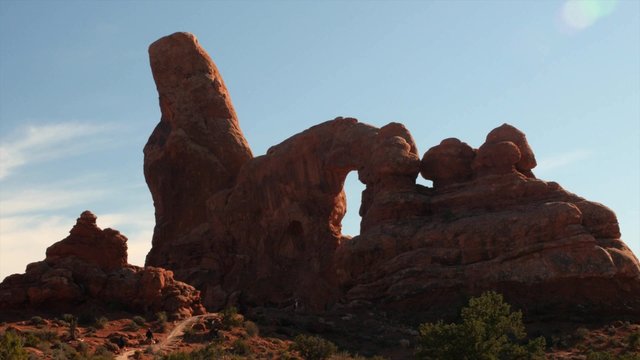 Tourists at turret arch in arches national park
