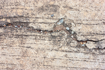 Cement floors are old and dirty.