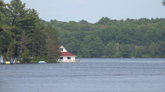 Boathouse on a blue lake