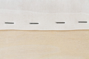 Staple cloth on wooden frame