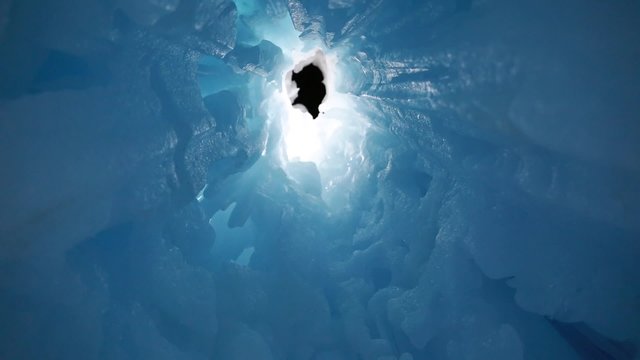 families walking in an ice cave