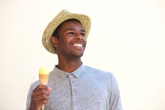 Smiling Young Man Holding Ice Cream Cone