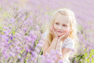 portrait smiling toddler girl in lavender