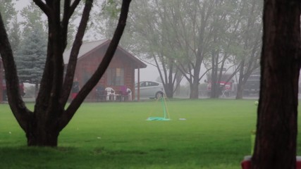 teens playing soccer in rain