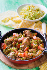 Chicken stew with onion, pepper ant tomato