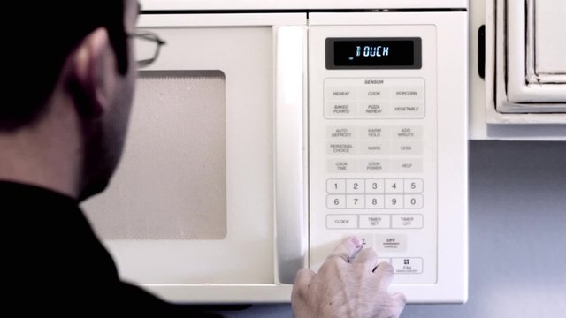 Man turns on microwave