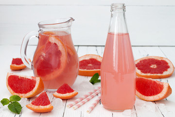 Detox fruit infused flavored water with cherry, lemon and mint. Refreshing summer homemade cocktail. Clean eating