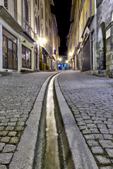 Vertical panorama in the streets of Briancon with streams