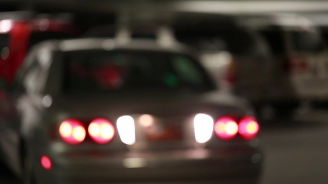 cars pulling into parking garage space