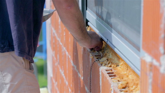 Pushing parts of propene in to holes of red bricks