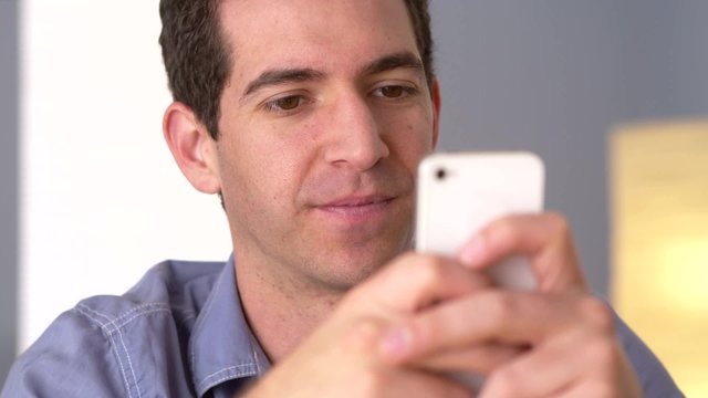 Man texting on smartphone