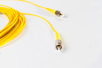 Naklejka premium Close up of a fiber optic patchcord on white background