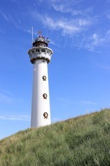 Fototapeta na wymiar Lighthouse in Egmond aan Zee. North Sea, the Netherlands. 