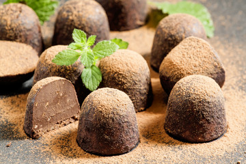 Homemade chocolate truffles with mint sprinkled with cocoa powde