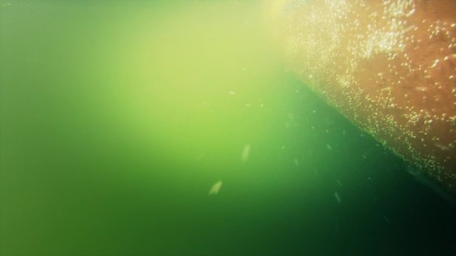 An Underwater Shot Of A Boat Hull Moving Through Water