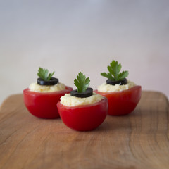 Tomatoes stuffed with cheese and garlic
