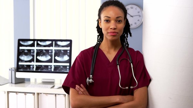 Portrait of African American woman medical doctor in hospital