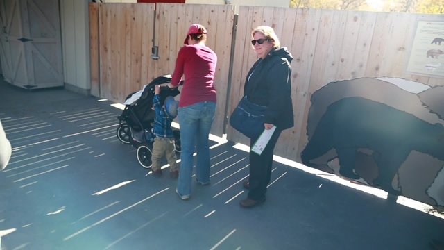 toddler with family at the zoo