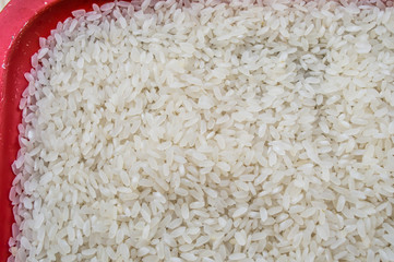Closeup of white rice in a red tray