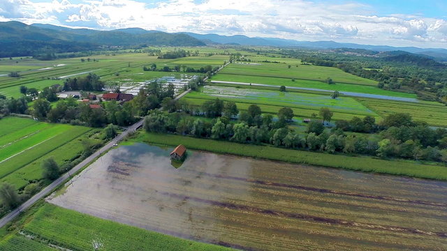 Aerial Landscape Shot Of Flooded Farm On A Sunny Day