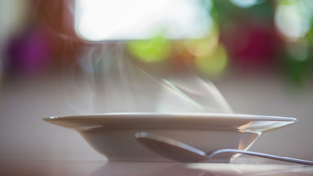 A lot of steam from soup plate