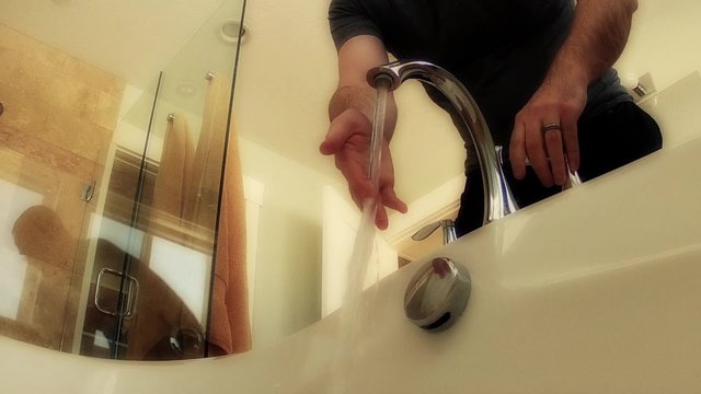 man fills bathtub